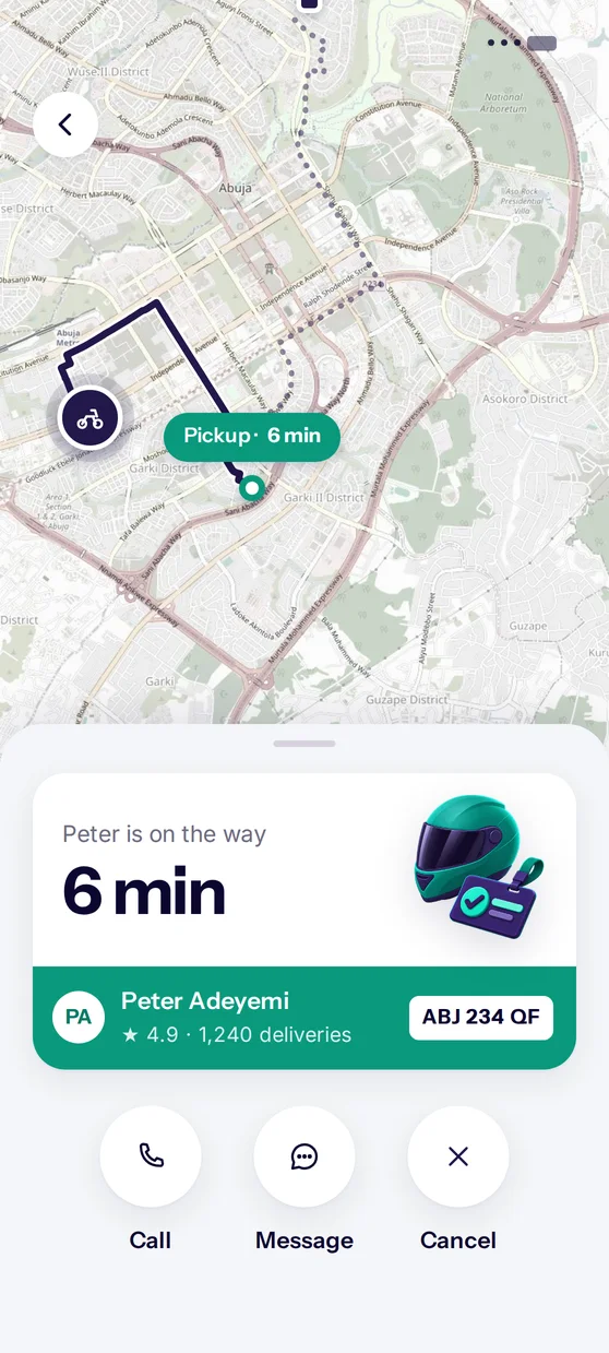 A QuickFleet app screen showing a rider on the way to a pickup on a map of Abuja